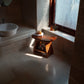 Solid Wood Bathroom Stool with Sculpted Seat and Open Shelf Storage