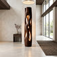 Tall Sculptural Solid Wood Floor Lamp with Open-Cut Design and Warm Ambient Lighting
